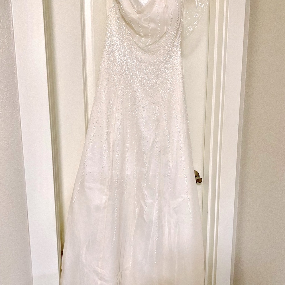 White, strapless, beaded gown. Used once.